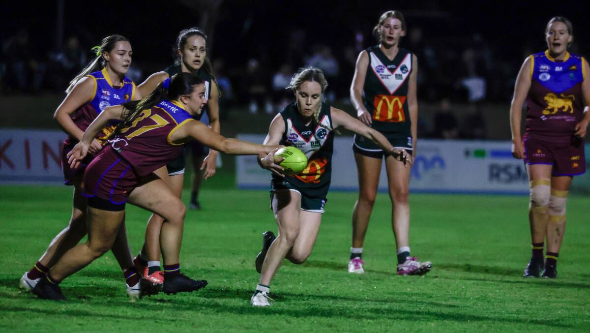Coolamon's Sophie Gaynor clears through traffic during her best on ground performance in the Southern NSW Women's League grand final on Friday. Picture by Bernard Humphreys