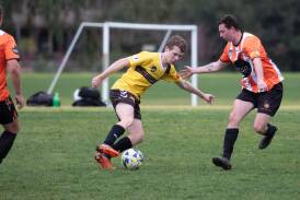 Tumut's Bryton Creati is cornered by Wagga United's Aaron Reilly during the 2023 Pascoe Cup season. Picture by Madeline Begley