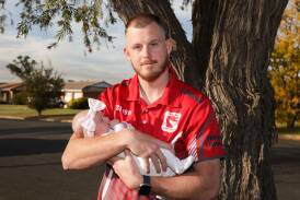 Temora winger Joel Kelly returned to the field this season, pictured with daughter Daisy Kelly (five weeks). Picture by Tom Dennis