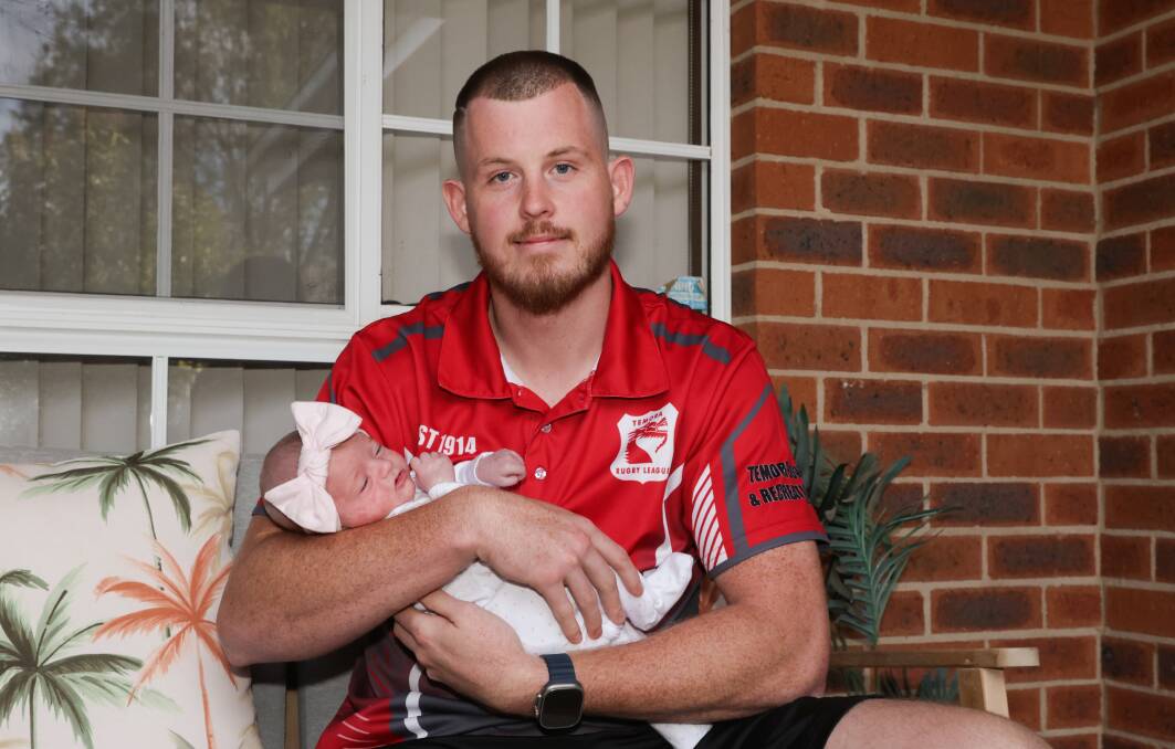 League leading try-scorer Joel Kelly pictured with five week old daughter Daisy. Picture by Tom Dennis