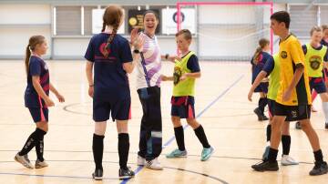 Michaela Thornton visits Wagga Futsal at Equex Centre on Monday afternoon, wrapping up a game with 'Skill School' players. Picture by Madeline Begley