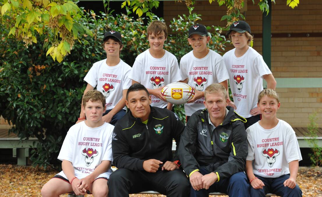 Liam Martin (sitting far left) with Canbera Raiders Josh Papalii and Glen Turner at a Country Rugby League Development Camp in 2011. 