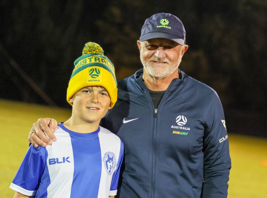 Tolland under 13s player Jack Miller with Graham Arnold after winning the crossbar challenge. Picture by Les Smith