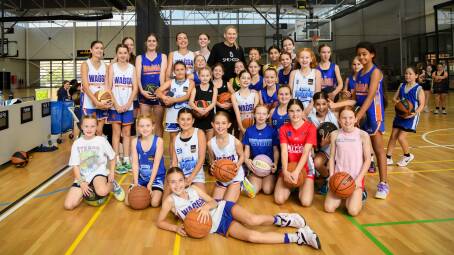 Lauren Jackson with Wagga Basketball representative players during her She Hoops program. Picture by Bernard Humphreys
