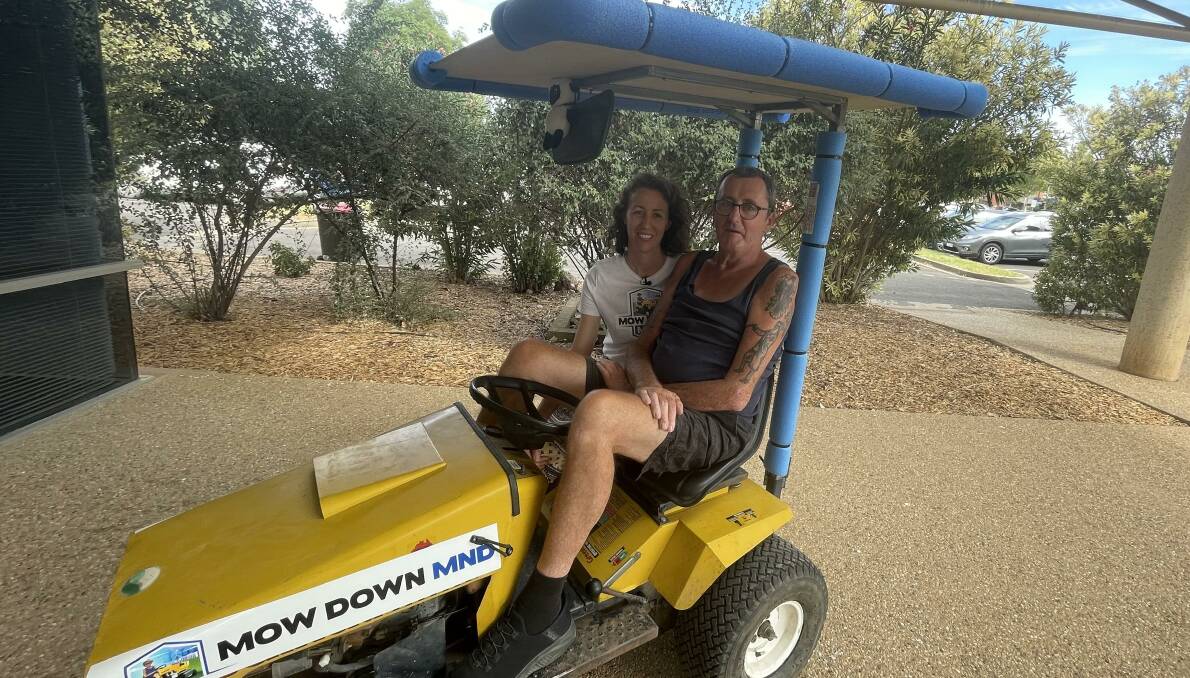 Warren 'Wozza' Acott, pictured with his daughter Belinda Acott in Griffith on Thursday, is riding a lawnmower from northern Victoria to Canberra, via the Riverina, to put politicians on notice. Picture by Allan Wilson