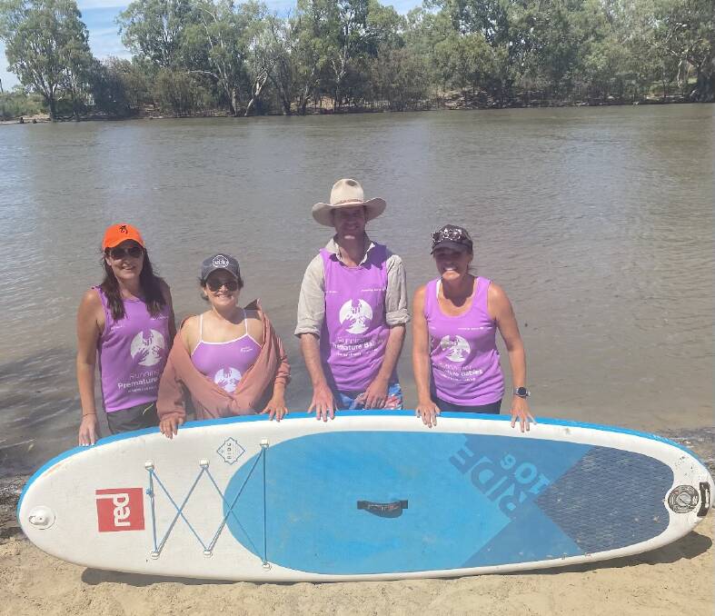 Pictured: Sally Crooke, Sheila Smith, Grant Volz and Sarah Houston at the river following the epic paddle boarding feat. PHOTO: supplied