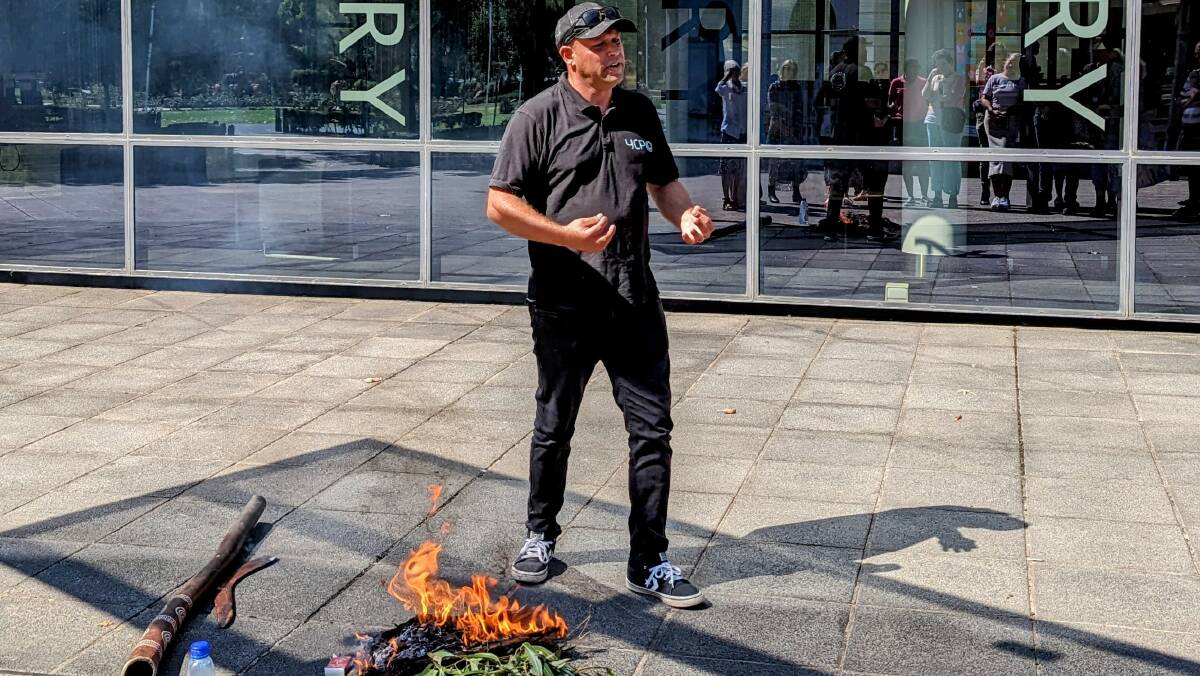 Luke Wighton removes negative energy from the space with a smoking ceremony