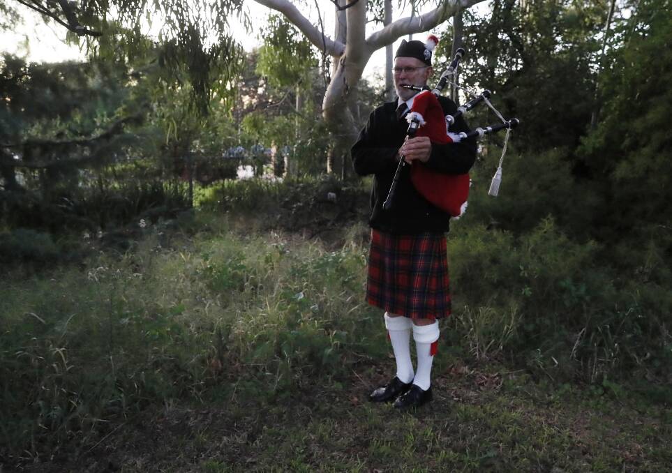 Piper Ken Lansdown at Anzac Day service at the Wagga War Cemetery on Tuesday morning. Picture by Les Smith.
