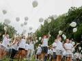 Mount Austin Public students release 60 white balloons to mark White Ribbon Day. Picture by Les Smith