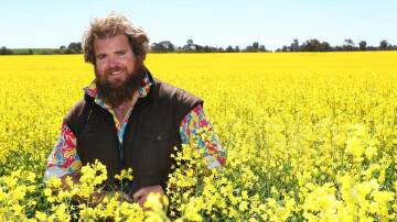 Simon Moloney among his canola crop in better years. File picture