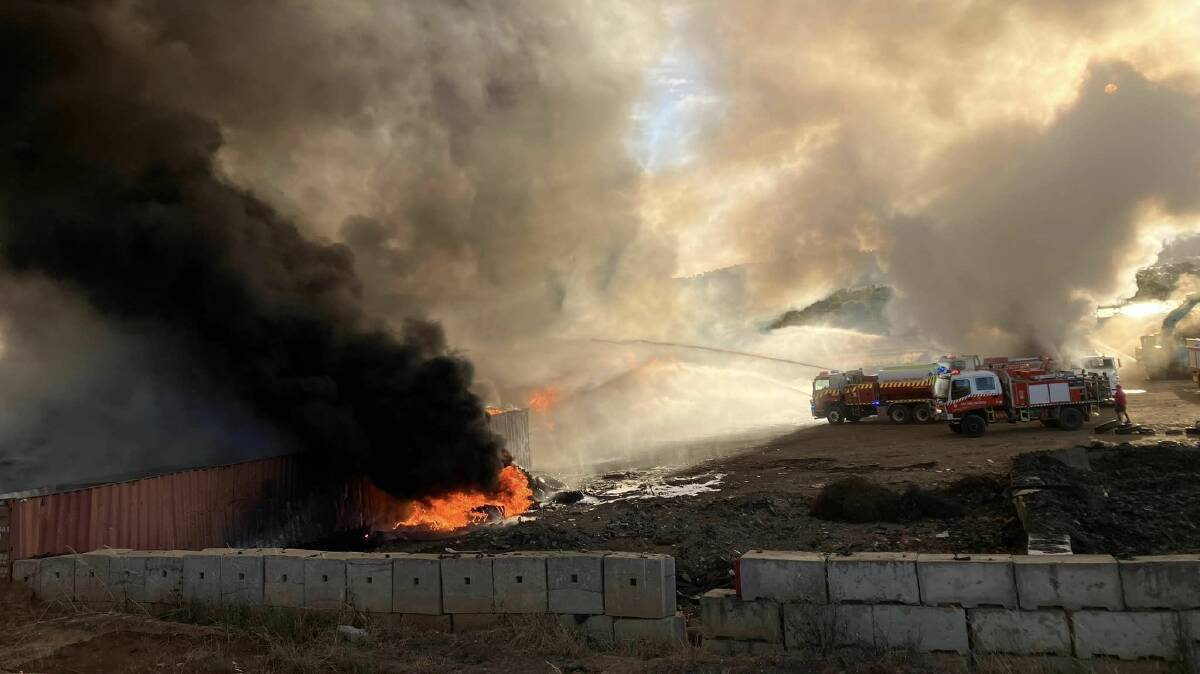 Firefighters working to control thousands of tons of burning mattresses and tyres near Cootamundra. Picture supplied