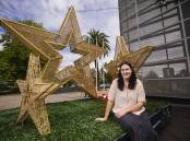 Wagga City Council events officer Emma Corbett with the newly-installed Christmas decorations near Wagga's Civic Centre. Picture by Ash Smith