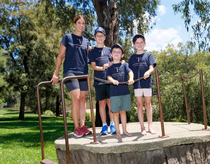 Genevieve O'Hare of The Torie Finnane Foundation with her children, Abbie, 8, Hugh, 5 and Ted, 10, will be tackling The Top of Oz for Torie walk on Saturday. Picture by Les Smith