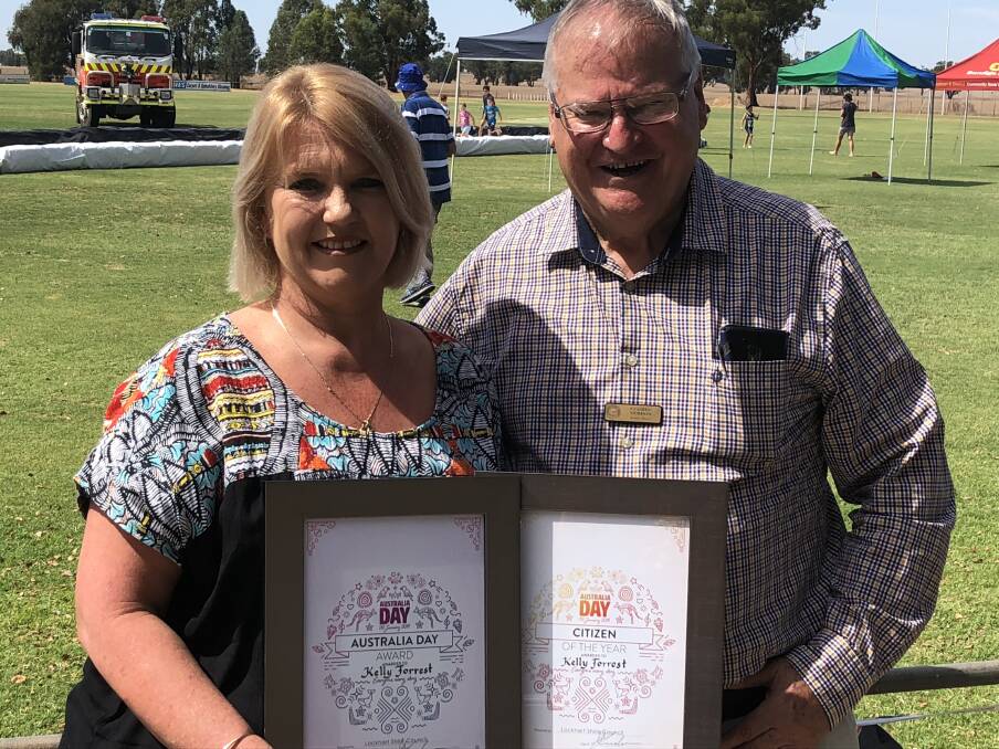 TOP HONOURS: Kelly Forrest of The Rock is acknowledged as the citizen of the year for Lockhart Shire by deputy mayor Greg Verdon: Picture: Nikki Reynolds