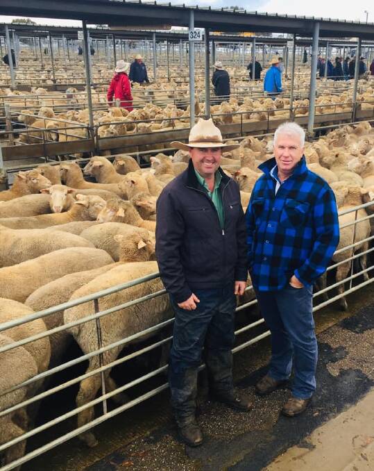 MARKET HIGH: Bill Schulz of Bandywallop Pastoral Company (right) sold lambs, estimated to weigh 42kg dressed, for $340. He is pictured with Jarrod Slattery of Landmark Wagga. Picture: Shannon Wicks