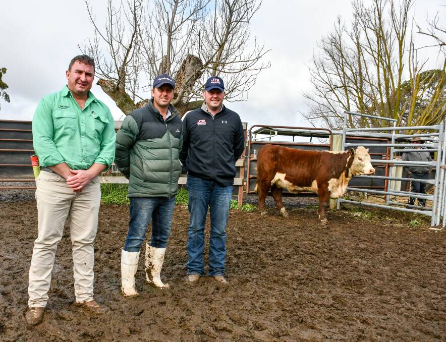 SEED STOCK MARKET: Females hit an $8000 high at Yalgoo Poll Hereford sale paid by Tim Reid, JTR Cattle Co, Roslyn, (right) pictured with Nutrien agent Tim Woodham, Wagga and vendor Jock Nivison. 