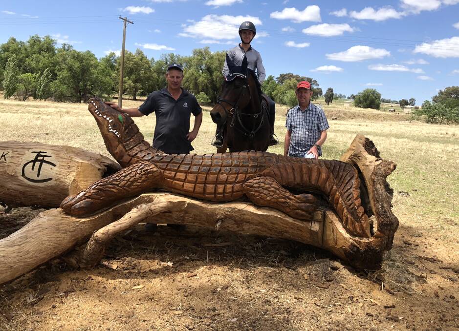 SPORT AND CREATIVITY: Chainsaw carving specialist, Justin McClelland, rider Zac Bryce and agistment princnipal, Malcolm Edgar all of Wagga. Picture: Nikki Reynolds