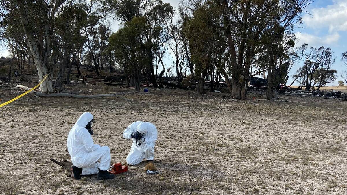 Air Transport Safety Bureau investigators at the C-130 air tanker crash site at Peak View on Saturday. Picture supplied by ATSB