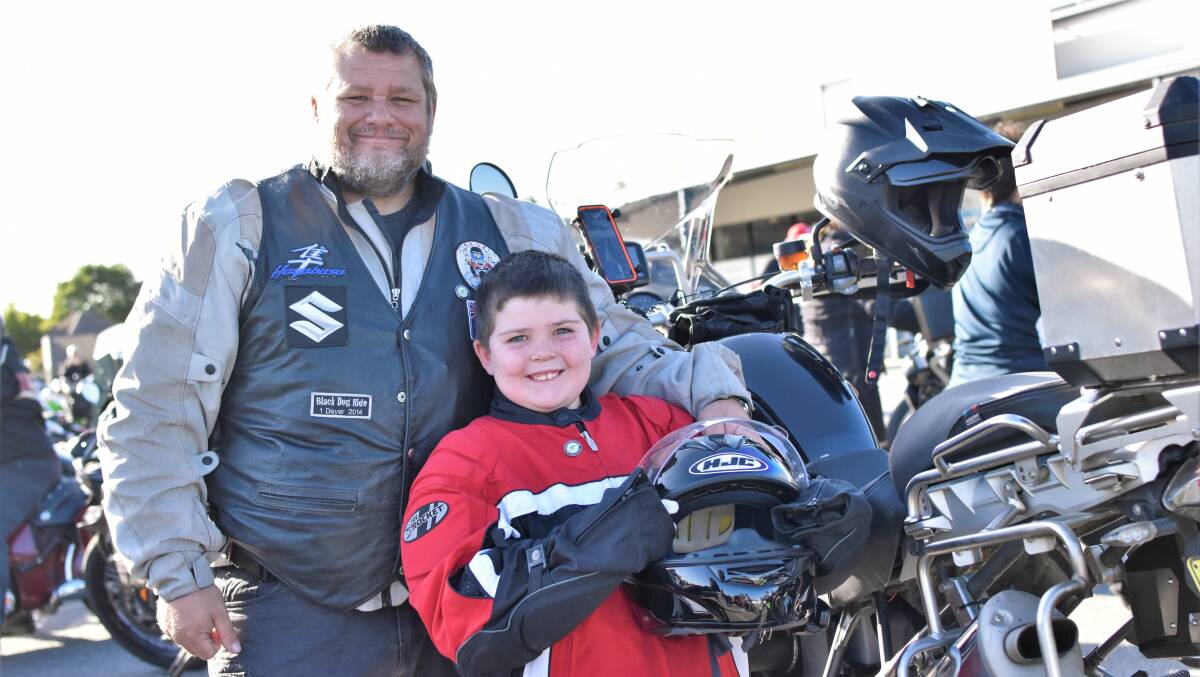 TEAM GORDON: Father David Gordon and 8-year-old son Jacob Gordon join the Black Dog Riders on their one-dayer. Picture: Kenji Sato