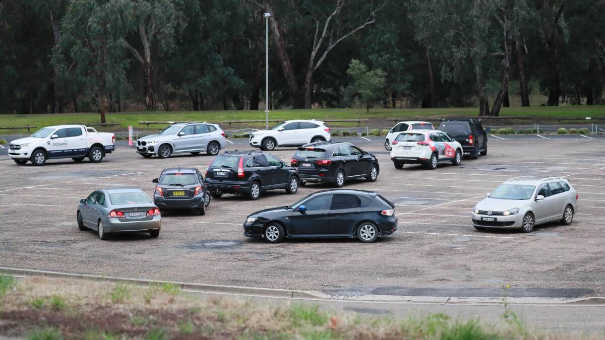 The drive-through COVID clinic at Wagga beach was jam packed on Sunday. At its peak, the traffic snaked all the way down the road and past the Saint Michael's Cathedral on Johnston Street. Picture: Les Smith