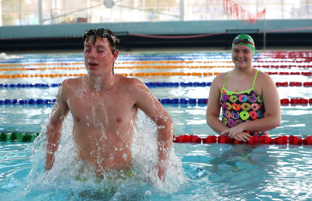 MAKING A SPLASH: William Beggs and Lilly Holtorf have resumed swimming lessons at the Oasis Regional Aquatic Centre after months in lockdown. Picture: Emma Hillier
