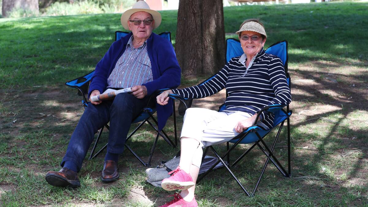 Charles Baker and Gayle Baker enjoy a rare moment of sun. Picture: Emma Hillier