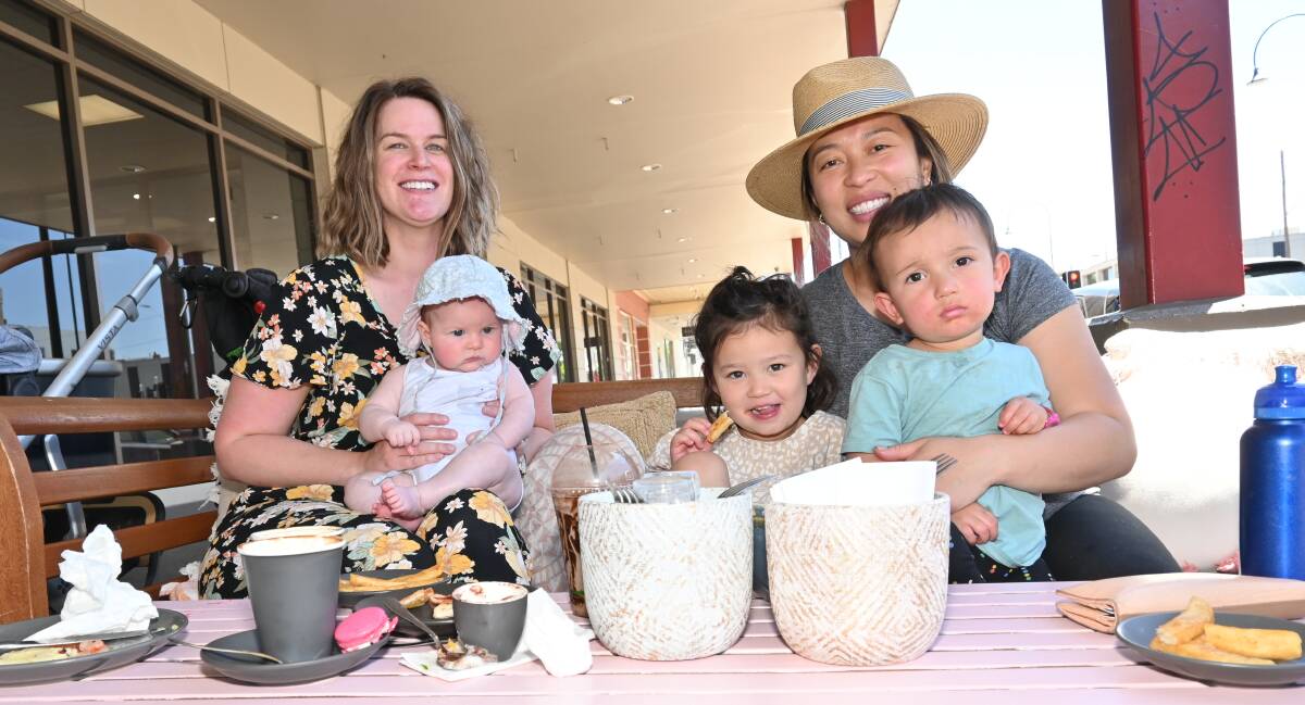 MUMS OUTING: Katherine Sly, Dulcie Sly, Kim Corrigan, Ruby Corrigan, and Archie Corrigan enjoy a breath of fresh air during one of their rare lunch outings. They say the vouchers will help them have a few more outings in future. Picture: Kenji Sato