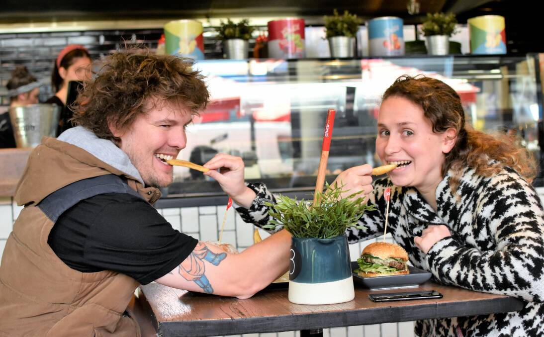 LOVE AT FIRST BITE: Cute couple Ethan Buik and Celeste Cordner-Loff celebrated their one-year anniversary on Friday. Picture: Kenji Sato