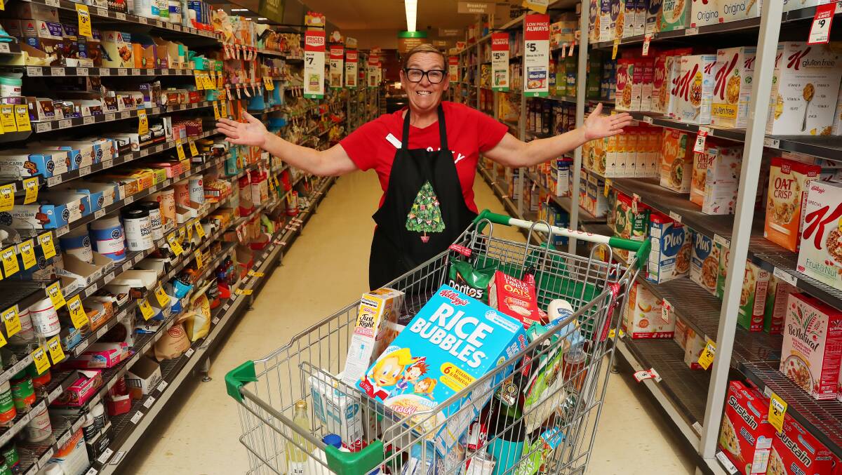 SENTIMENTAL SHOP: Woolworths worker Peta Brown had her heartstrings plucked when witnessed saw a shopper help out a complete stranger just a few days before Christmas. Picture: Emma Hillier