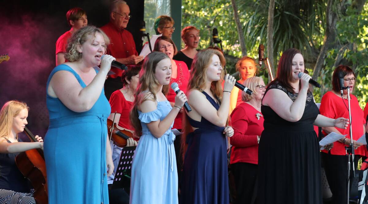 SINGERS: Natalie, Anna, Hannah and Erin perform carols to an audience of more than 2000 at the Wagga Inter Church Council Carols in the Park. Picture: Les Smith