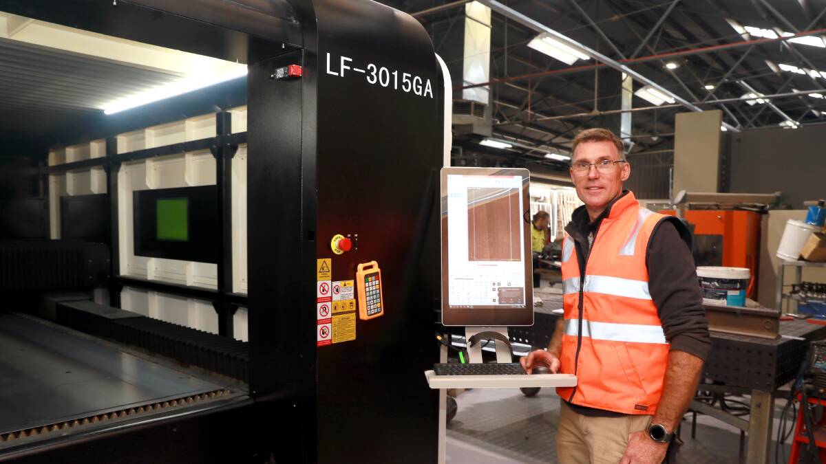 ABUZZ: Wagga Stainless Steel owner David Wheeler was unable to find enough workers, so he bought a giant laser last week to help ease the workload. Mr Wheeler said the tradie shortage was a perrennial problem for Wagga manufacturers. Picture: Les Smith