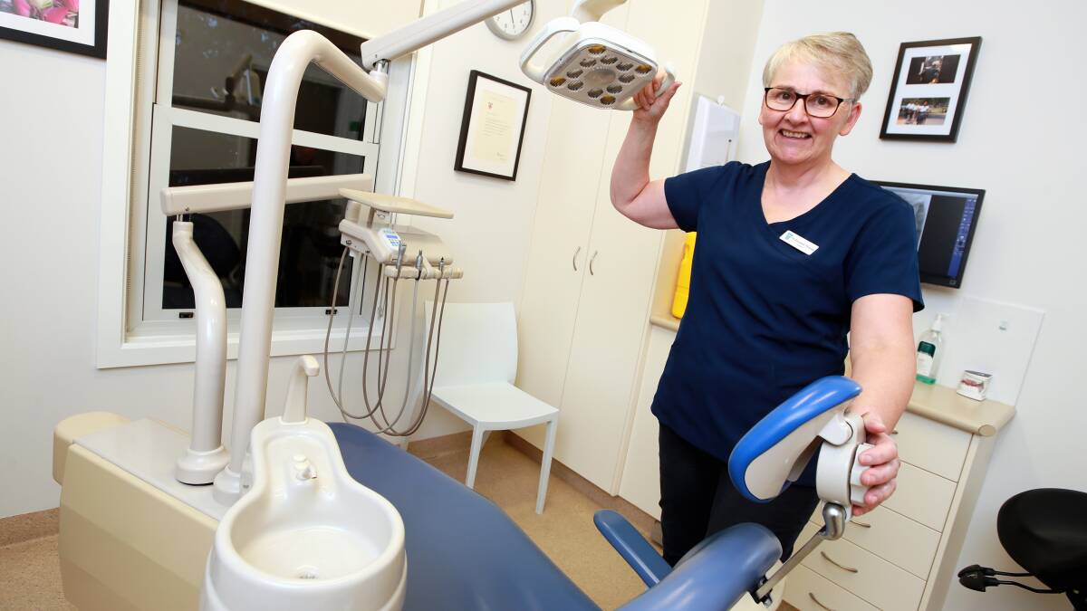 ALL SMILES: Best St Dental dentist Rosemary Morgan is glad to be back at work after weeks of coronavirus restrictions. Picture: Les Smith