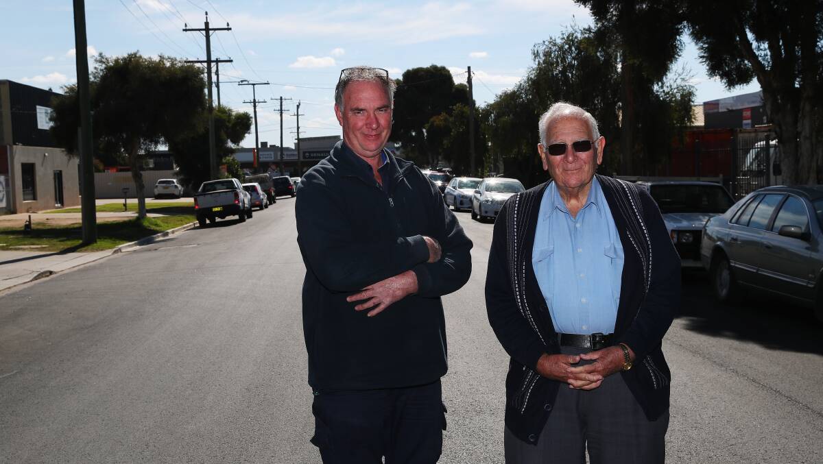 PRIZED PARKING: Rob Vidler and his father Lindsay Vidler are upset about council's decision to put time restrictions on parking along their street. Picture: Emma Hillier
