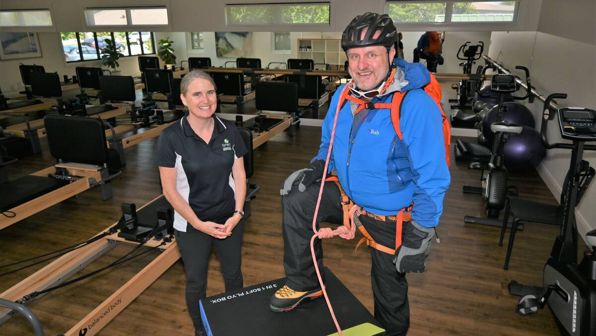 NEW HEIGHTS: Veteran Alistair Mills has gone from being totally bed-bound to summitting icy mountains in New Zealand with the help of his his exercise physiologist Kylie Franklin. Picture: Kenji Sato
