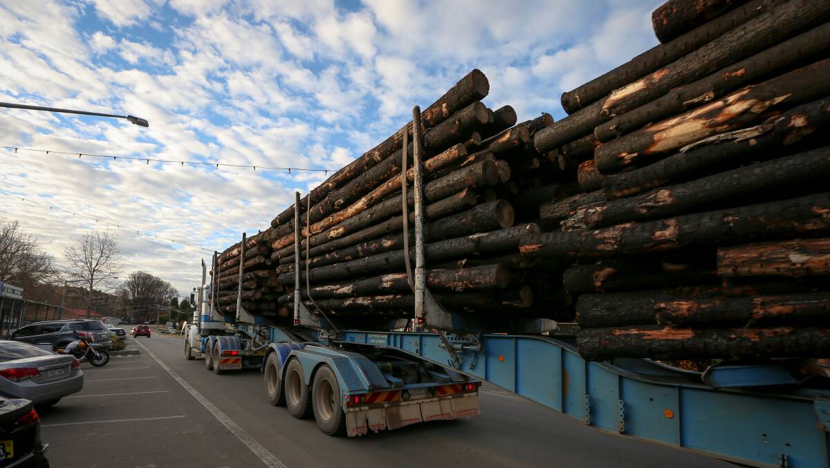 A fully laden semi-trailer of burnt timber moves through the main street of Tumbarumba. Picture: James Wiltshire
