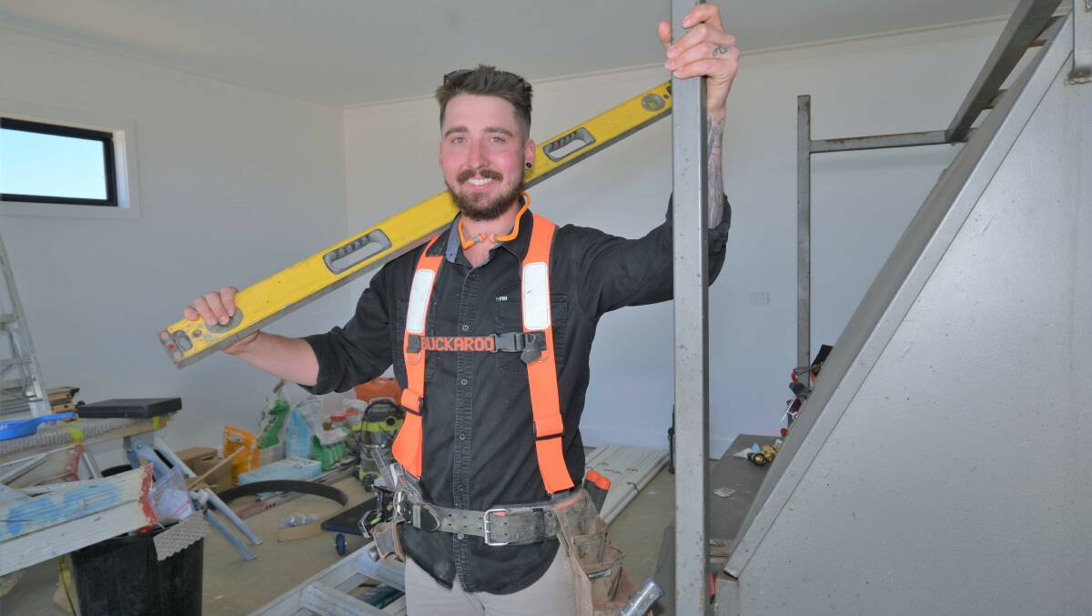 ON THE TOOLS: Young carpenter and plasterer Samuel Hamilton is fulfilling his childhood dream of becoming a builder. Picture: Kenji Sato