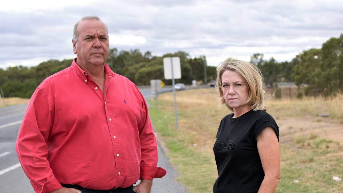 ROAD RAGE: Paul Funnell and Shantal Armstrong say they've had many near-misses while driving through the Old Narrandera Road intersection, and they're demanding the government take swift action. Picture: Kenji Sato