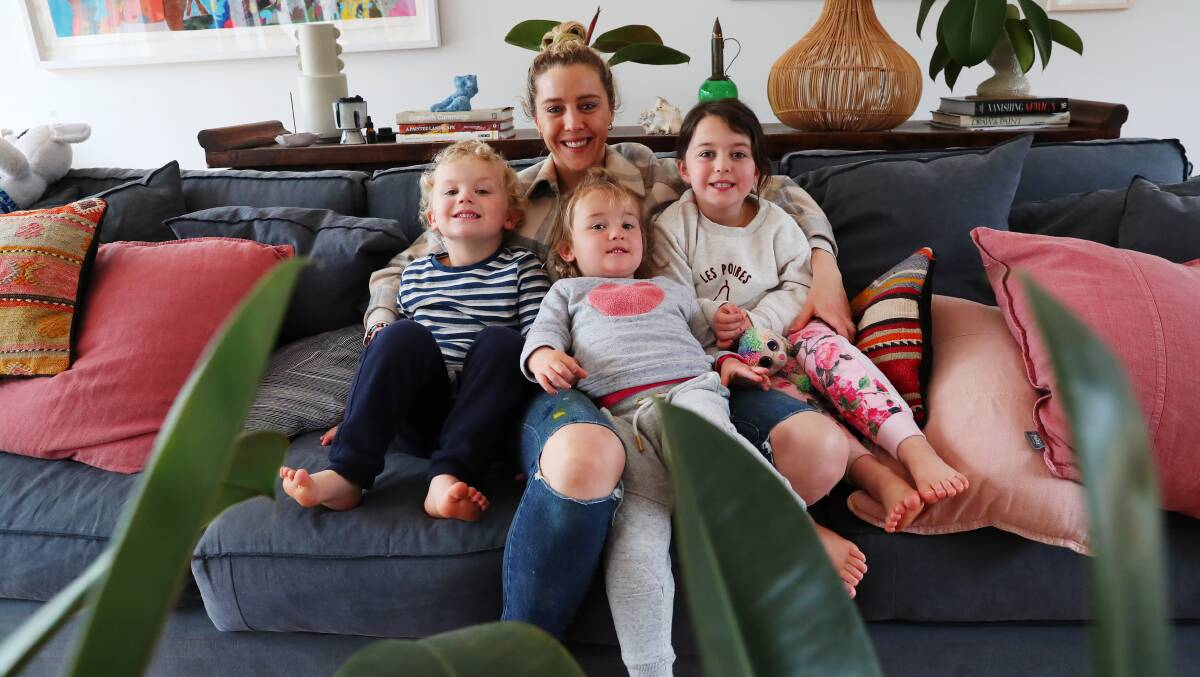 FAMILY HUDDLE: Jimmy, Julia, Francesca, and Rosie Roche traded in the Sydney life for the laid-back country lifestyle in Wagga, and they have not looked back once. Picture: Emma Hillier