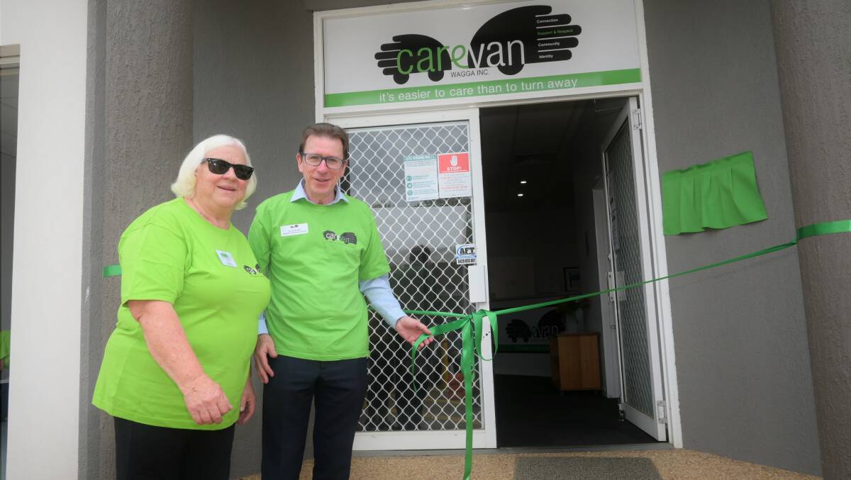 Founder Lynne Graham and volunteer/MP Joe McGirr officially open the new warehouse. Picture: Kenji Sato