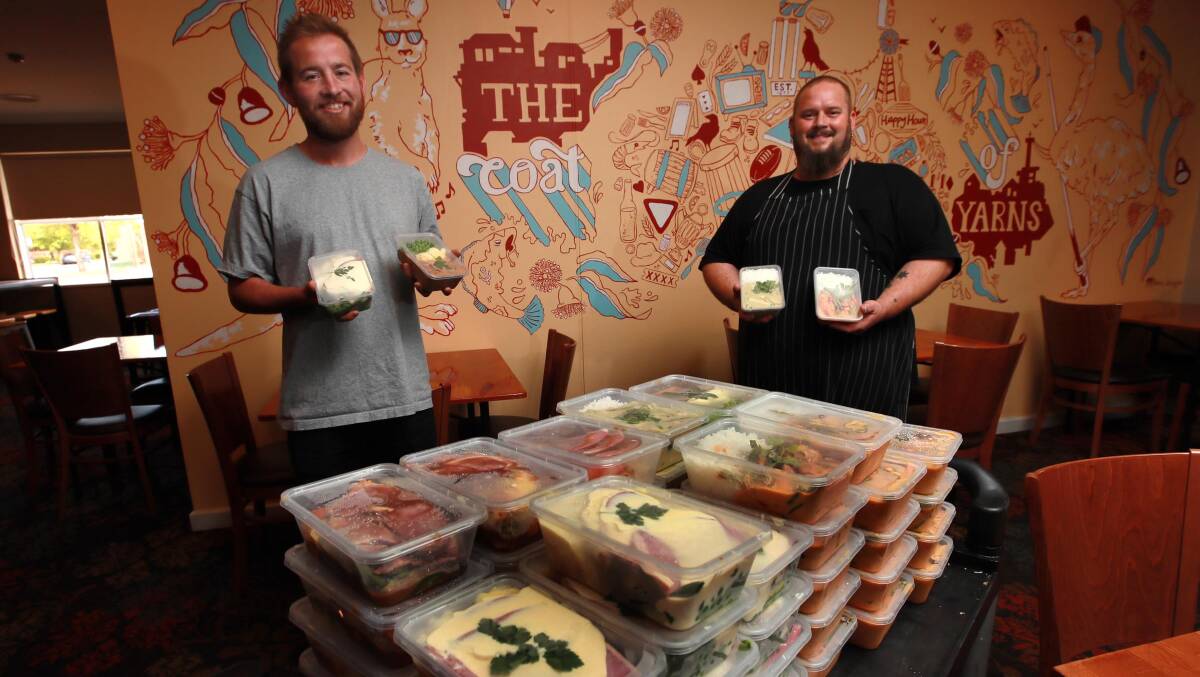 GOOD SPORTS: Sportmens Club Hotel licensee Tommy Stratton and head chef Peter Hadkins are serving up at-cost takeaway meals to struggling locals. Picture: Les Smith