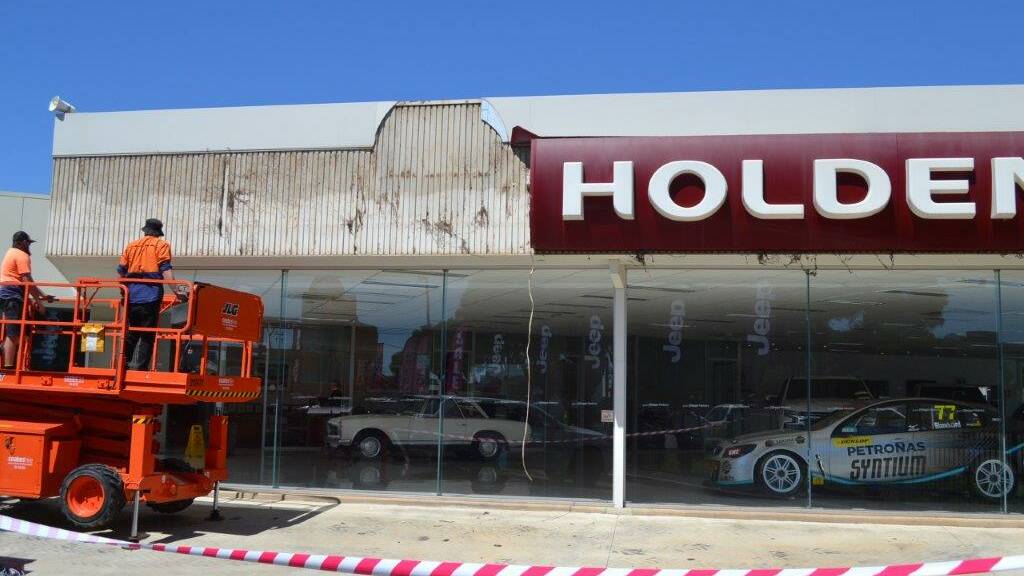 The Holden signs being taken down. Picture: Contributed