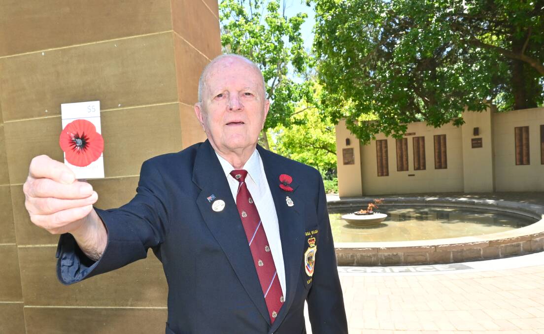 POPPY POWER: Peter Randal has been volunteering for the RSL for over 60 years, and has no intention of stopping any time soon. Picture: Kenji Sato