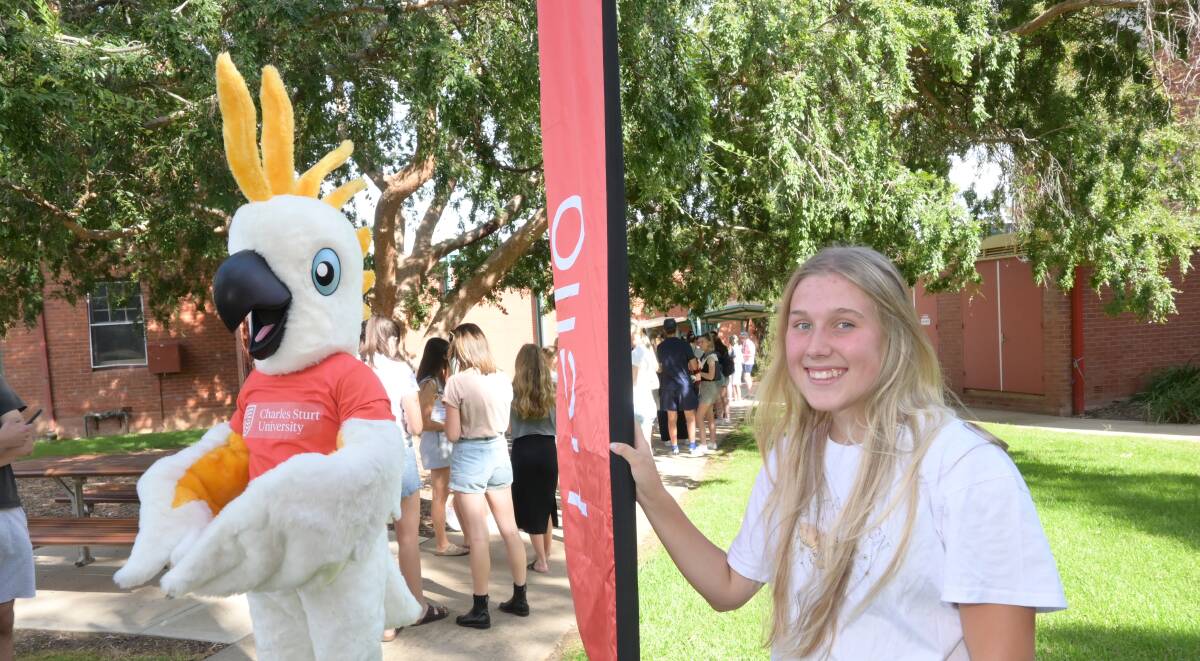 BRANCHING OUT: New animal science student Alexis Gifford, with Charlie the cockatoo, looks forward to starting the next chapter of her life at Charles Sturt University. Picture: Kenji Sato