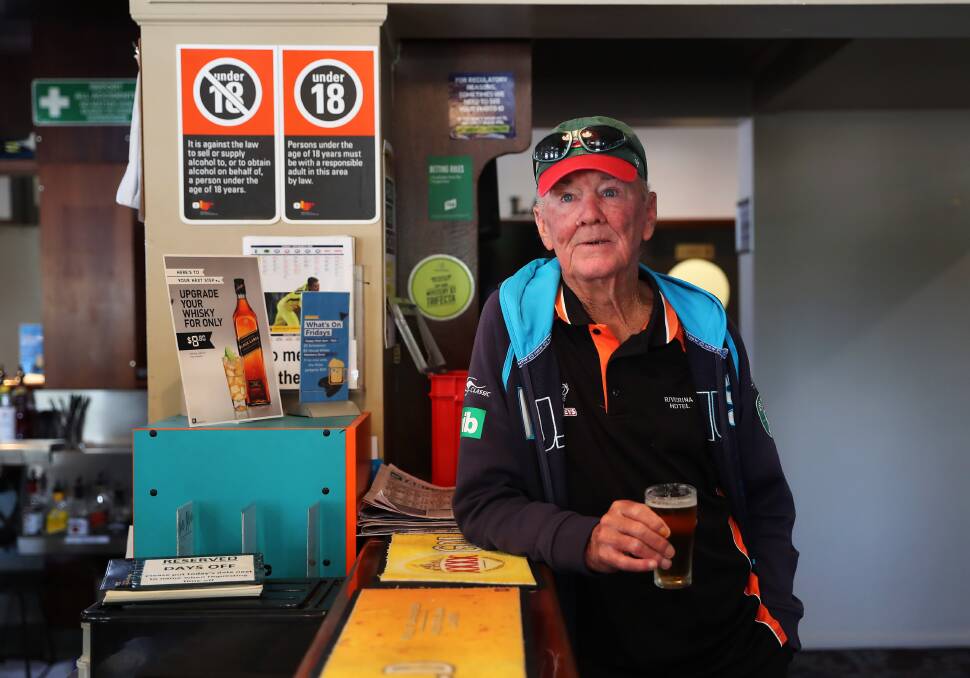 AUSTRALIAN TRAGEDY: Barry Gibbons downs one last beer at the Riverina Hotel. Now that all the pubs are closed Mr Gibbons has stocked his fridge with beer. Picture: Emma Hillier