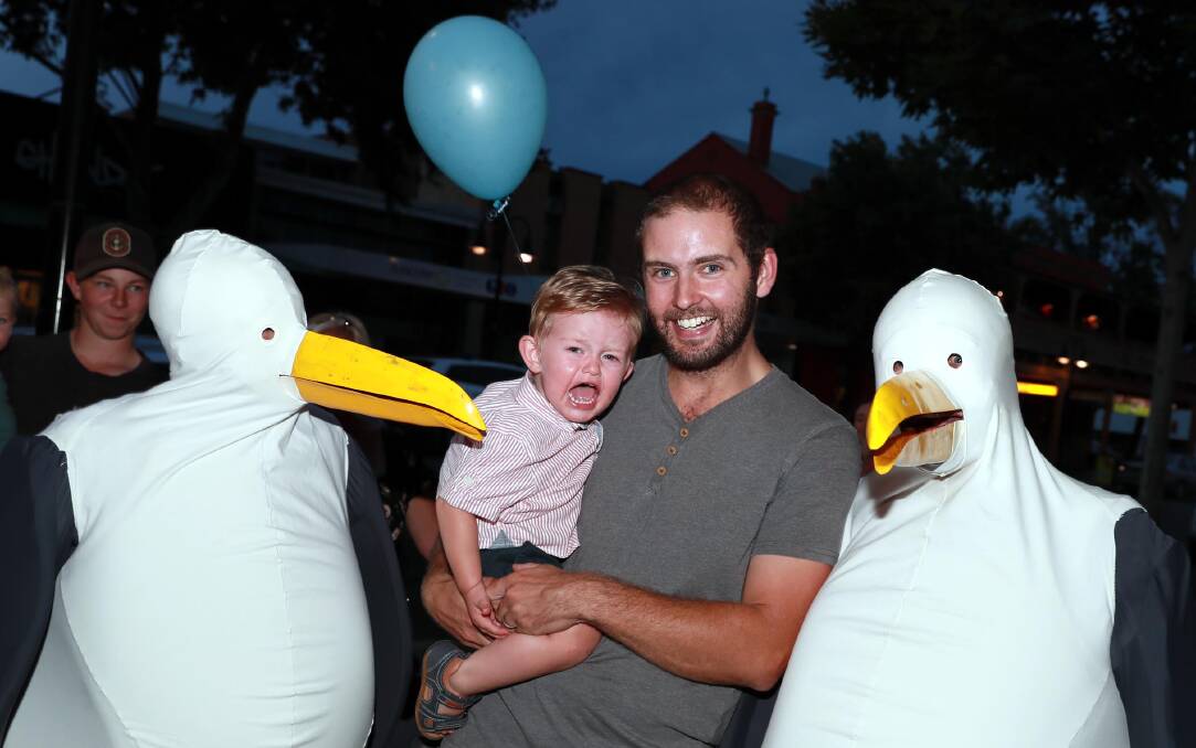 18-month old Chris Thomson with dad Darby Thomson and giant seagulls Rachael Rowan and Mike Rowan. Picture: Les Smith
