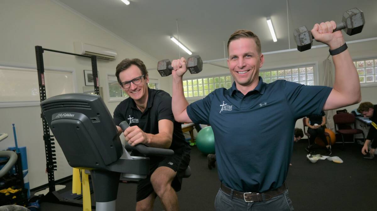 PHYSICAL: Exercise physiologist Jake Dargan and physiotherapist Andrew Preston urge people to ease themselves back into sport. Picture: Kenji Sato