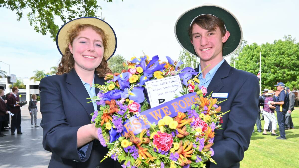 PAYING RESPECTS: Year 11 Kildare students Jacinta Byrne and Matt Anderson came to lay a wreath in commemoration for the fallen soldiers. Picture: Kenji Sato