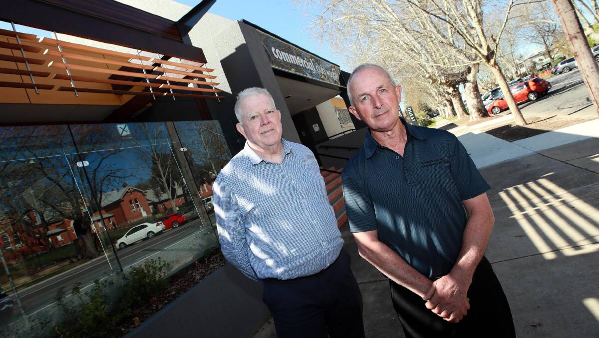SAD DAY: Peter Thomas and Andrew Bell say they had a "red hot go" at reviving the Commercial Club, but have to close it effective immediately. Picture: Les Smith