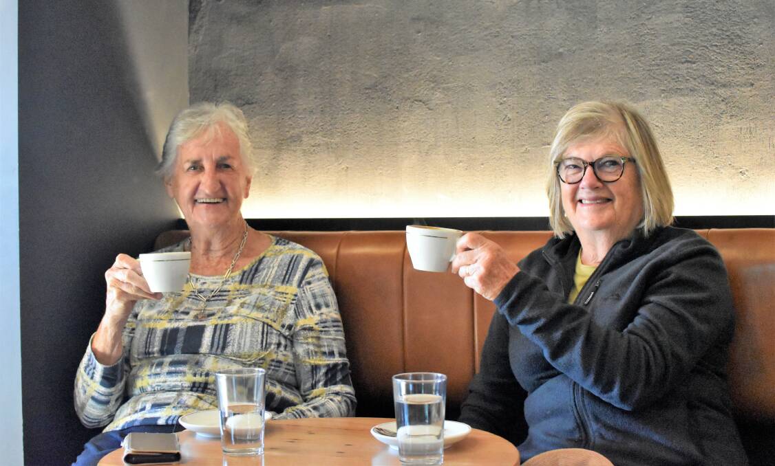 CHEERS: Retirees Cassie Gill and Judy Birks enjoy a nice cup of coffee on Friday. Picture: Kenji Sato