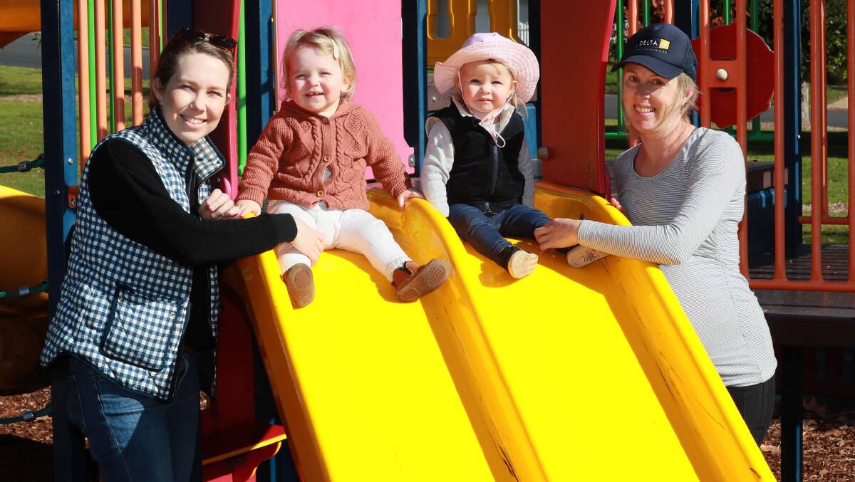DOUBLE PLAYDATE: Emma Mead with her daughter Audrey Mead, and Elissa Mitchell with her daughter Lucy Mitchell, enjoying a day out at the Botanic Gardens children's playground. Picture: Les Smith